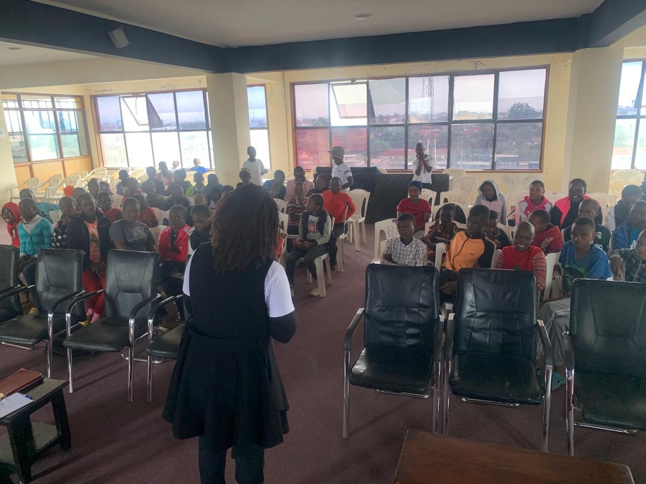 A GIANTS gathering with teenagers listening to a speaker