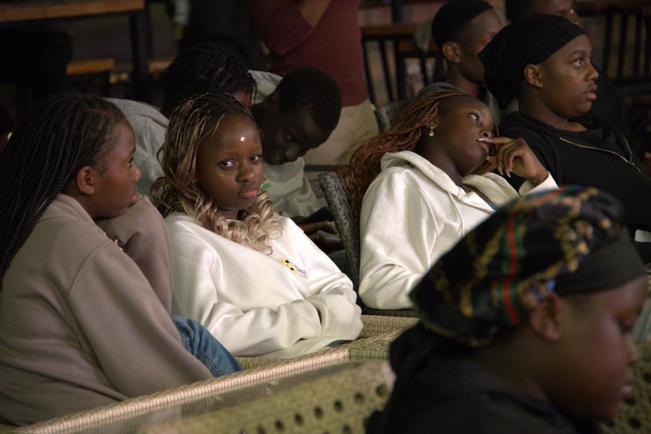 Teenagers listening during a GIANTS camp session